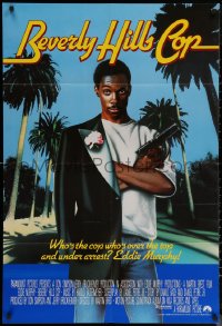 6h0655 BEVERLY HILLS COP int'l 1sh 1984 best different art of Eddie Murphy with half tux & gun!