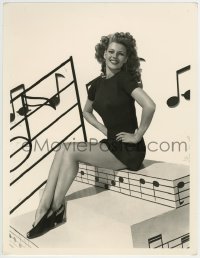 6p0272 RITA HAYWORTH deluxe 11x14.25 RE-STRIKE 1970s seated portrait with musical notes & sexy legs!
