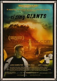 6y0235 RIDING GIANTS linen 1sh 2004 really great image of surfers on beach holding surf boards!
