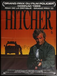 7c1094 HITCHER French 1p 1986 different image of bloodied Rutger Hauer with machine gun!