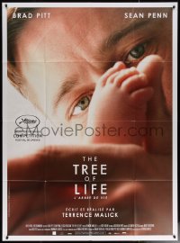 7c1438 TREE OF LIFE French 1p 2011 super close up of Brad Pitt looking at baby's feet!