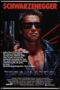 7m1188 TERMINATOR 1sh 1984 close up of classic cyborg Arnold Schwarzenegger with gun, border style!