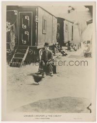 7r0114 CIRCUS 8x10.25 still 1928 great image of Tramp Charlie Chaplin sitting alone by circus cars!