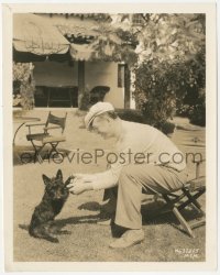 7r0359 MAURICE CHEVALIER candid 8.25x10.25 still 1934 at home with his dog, making The Merry Widow!