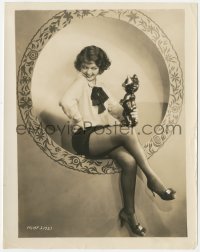 7r0453 SALLY STARR 8x10.25 still 1920s seated in nylons holding ceramic cat in circular window!
