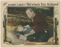 7r0903 BEYOND THE BORDER LC 1925 close up of Harry Carey Sr. with unconscious Mildred Harris!