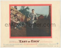 7r1049 EAST OF EDEN LC #1 1955 concerned James Dean running past sitting men, John Steinbeck, Kazan!