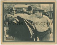 7r1246 LONESOME LUCK LC 1923 close up of cowboy hero Jack Dougherty punching bad guy, rare!
