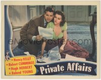 7r1362 PRIVATE AFFAIRS LC 1940 Bob Cummings & pretty Nancy Kelly read through lots of papers!