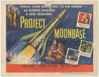 7r0765 PROJECT MOONBASE TC 1953 Robert Heinlein, cool art of rocket ship + wacky astronauts!