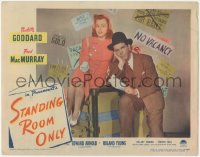 7r1466 STANDING ROOM ONLY LC #3 1944 c/u of Fred MacMurray & Paulette Goddard sitting on luggage!