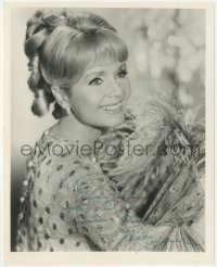 7w0884 DEBBIE REYNOLDS signed 8.25x10 REPRO still 1980s smiling portrait with floral print & feathers!
