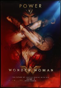 7x0219 WONDER WOMAN DS bus stop 2017 image of sexiest Gal Gadot in title role with arms crossed!