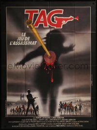 7y1235 TAG: THE ASSASSINATION GAME French 1p 1983 Landi art of bloody dart hitting silhouette!
