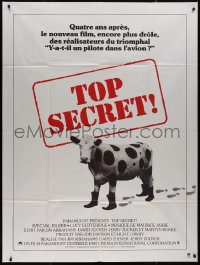 7y1266 TOP SECRET French 1p 1984 Zucker Bros. James Bond spy spoof, wacky image of cow with boots!