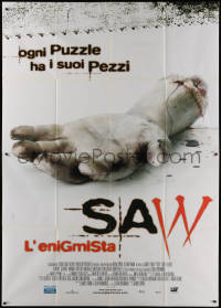 7y0472 SAW Italian 2p 2004 gruesome close up image of severed arm, every puzzle has its pieces!