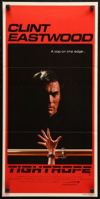 8f0445 TIGHTROPE Aust daybill 1984 Clint Eastwood is a cop on the edge, cool handcuff image!
