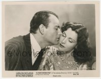8k0275 MAN BETRAYED 8x10.25 still R1953 close up of John Wayne kissing Frances Dee on the cheek!
