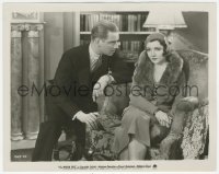 8k0494 WISER SEX 8x10.25 still 1932 close up of Melvyn Douglas staring at seated Claudette Colbert!