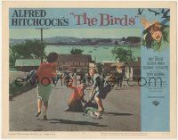 8k0799 BIRDS LC #4 1963 Alfred Hitchcock classic, terrified villagers flee down city road!