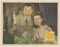 8k0827 CASTLE IN THE DESERT LC 1942 Sidney Toler as Charlie Chan holding candle by Arleen Whelan!
