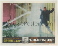 8k0928 GOLDFINGER LC #3 1964 Sean Connery as James Bond watches Oddjob get electrocuted on fence!