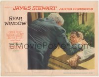 8k1143 REAR WINDOW LC #3 1954 Alfred Hitchcock, Raymond Burr pushes Jimmy Stewart out of window!