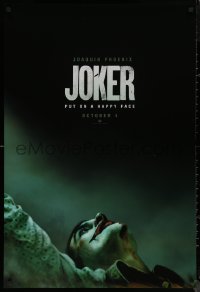 8p0977 JOKER teaser DS 1sh 2019 close-up image of clown Joaquin Phoenix, put on a happy face!