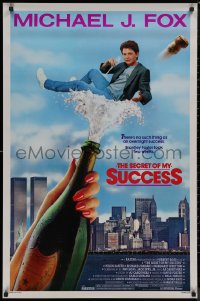 8p1175 SECRET OF MY SUCCESS 1sh 1987 wacky image of Michael J. Fox & huge bottle of champagne!