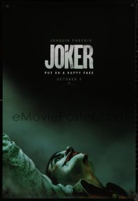 8y1059 JOKER teaser DS 1sh 2019 close-up image of clown Joaquin Phoenix, put on a happy face!