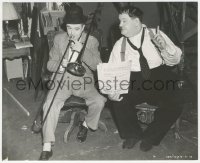 8z0504 SAPS AT SEA candid 7.5x9.25 still 1940 Oliver Hardy holds music for trombonist Stan Laurel!