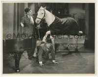 8z0622 WRONG AGAIN 7.75x9.5 still 1929 Oliver Hardy has horse step on Stan Laurel onto piano, ouch!