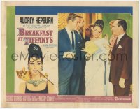 8z0945 BREAKFAST AT TIFFANY'S LC #5 1961 elegant Audrey Hepburn between Peppard & Balsam at party!