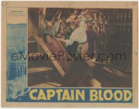 8z0632 CAPTAIN BLOOD LC 1935 great c/u of Errol Flynn holding sword over scared guy, Michael Curtiz