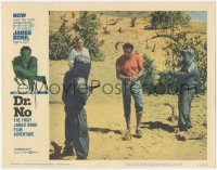 8z0687 DR. NO LC #1 1963 Ursula Andress watches Sean Connery as James Bond held at gunpoint!