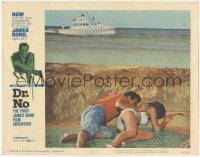 8z0688 DR. NO LC #2 1963 Sean Connery as James Bond & Ursula Andress hiding from boat behind sand!