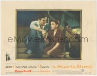 8z1381 STAR IS BORN LC #6 1954 by James Mason, great close up holding Judy Garland's hand!