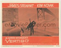 8z1451 VERTIGO LC #7 1958 Alfred Hitchcock, James Stewart carrying blonde Kim Novak by bridge!