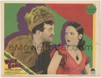 8z1477 WOLF SONG LC 1929 great c/u of smiling Louis Wolheim in fur cap flirting with sexy Lupe Velez!