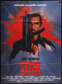 9b1732 STICK French 1p 1985 different image of Burt Reynolds with machine gun, Elmore Leonard, rare!