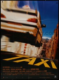 9b1740 TAXI French 1p 1998 written/produced by Luc Besson, great image of cab in mid air!