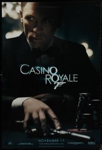 9f0767 CASINO ROYALE teaser DS 1sh 2006 Craig as James Bond sitting at poker table w/gun!