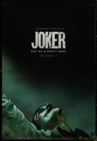 9f0927 JOKER teaser DS 1sh 2019 close-up image of clown Joaquin Phoenix, put on a happy face!