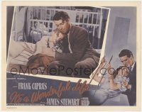 9j0783 IT'S A WONDERFUL LIFE LC R1955 great c/u of James Stewart putting his daughter to bed, Capra!