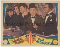 9j0864 OUR RELATIONS LC 1936 Oliver Hardy plugs Stan Laurel's ears so he doesn't hear bad news, rare!