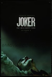 9k0842 JOKER teaser DS 1sh 2019 close-up image of clown Joaquin Phoenix, put on a happy face!
