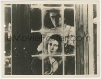 9p0676 GHOUL 8x10.25 still 1933 creepy Boris Karloff sneaks up behind woman looking out window!