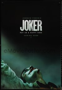 9r1234 JOKER int'l teaser DS 1sh 2019 close-up image of clown Joaquin Phoenix, put on a happy face!