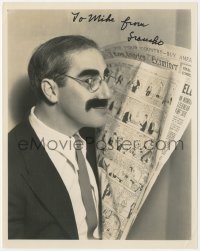 9s1006 GROUCHO MARX signed 8x10.25 still 1935 portrait with the newspaper funny pages by Lippman!