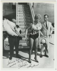 9s1357 SUE ANE LANGDON signed 8x10 REPRO photo 1980s in skimpy outfit as she disembarks airplane!